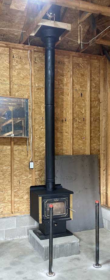 Wood stove installation in barn construction